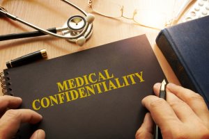 book with medical confidentiality across the front